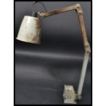 A 1950's mid century Industrial anglepoise factory work lamp light. The desk light with pendant