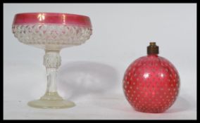 A vintage retro 20th century bubble control cranberry glass lamp base paperweight along with a