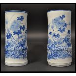 A pair of 19th century Chinese blue and white ceramic tall bamboo effect brush pots / vases hand