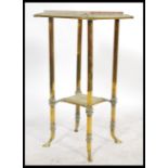 A vintage 20th century Antique style marble topped planter stand of gilt brass construction.