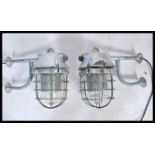 A pair of Industrial ' extreme condition ' heavy industrial bulkhead lights. Each with glass pendant