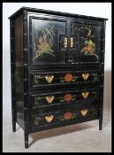 An antique style ebonised aesthetic movement tallboy chest / marriage cabinet with faux bamboo