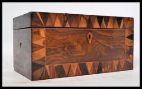 A 19th century Georgian rosewood tea caddy box having specimen inlaid borders. Hinged lid opening to