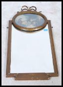 A decorative mid 20th century gilt mirror with swag decoration over print painting of musician and