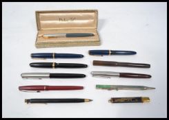 A collection of vintage ink / fountain pens to include three Parker Duofold pens with 14k gold nibs,