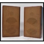 A pair of vintage early 20th century Art Deco wooden cased speakers of upright rectangular form with