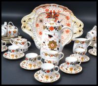 A Royal Crown Derby Imari pattern china tea service comprising cups, saucers, plates, teapots,