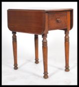 An early 20th century Regency revival Georgian style flame mahogany double drop end dining