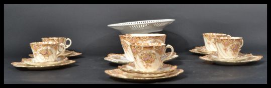 An early 20th Century Edwardian bone China transfer printed part tea service consisting of trio's,