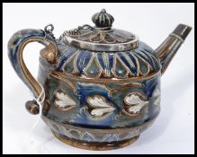 A 19th century Victorian Doulton Lambeth teapot having salt glazed tubelined decoration with