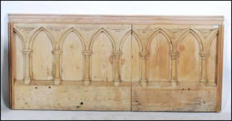 A large scrubbed pine early 20th Century ecclesiastical carved panel. The panel carved with arched