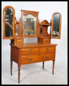 An Edwardian satin walnut dressing table chest of drawers having short over deep drawer