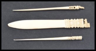 A group of 19th century European and Asian ivory to include two hair pins , elephant figurine ,
