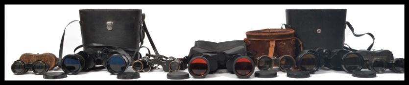 A good collection of vintage binoculars to include field glasses and opera most retaining original