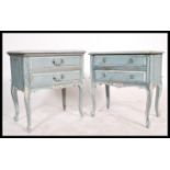 A pair of 20th century French oak painted Louis XV style bedside cabinets, hoof feet with cabriole