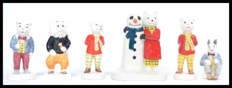 A group of mostly Beswick Rupert the bear and friends figures to include Rupert x2 one unmarked to