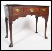 An 18th century Georgian mahogany writing desk / console table having front to back drawer lining