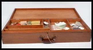 A vintage 20th Century wooden portable storage case, hinged top opening to reveal two removable
