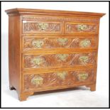 A 19th Century country oak chest of drawers, two short drawers over three long drawers, swag drop