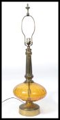 A vintage retro glass and brass table lamp in the manner of Murano, brass circular base with a