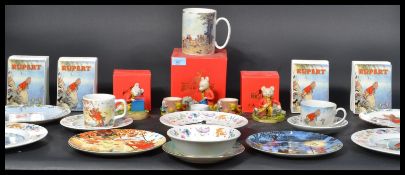 A collection of Rupert The Bear related items to include three boxes Arden Sculptures , Two pairs of