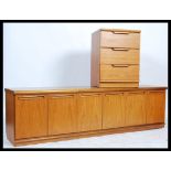 A retro vintage 20th Century Danish inspired low sideboard teak wood on plinth base together with