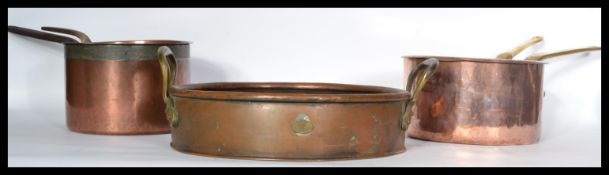 A group of 19th century Victorian copper pans to include a Temple and Crook Ironmongers example