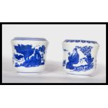 Two 19th century Chinese blue and white brush / water pots decorated with traditional scenes and