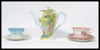 A group of English bone china ceramics to include a Shelley tall tea pot / coffee pot in Woodlana