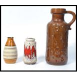 A group of three vintage 20th century West German ceramic vases to include fat lava and peacock