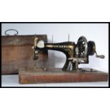 A late 19th Century Victorian hand crank sewing machine by Vickers, gilt detailing to the body