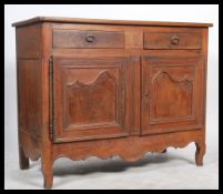 A 19th century solid oak chestnut dresser base with shaped feet having twin cupboard and 2 short