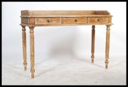 A Shabby Chic country hardwood painted console - writing table being raised on spiral twist legs