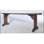 A   19th century French refectory pig bench. The bench with shaped single plant tops of fruitwood