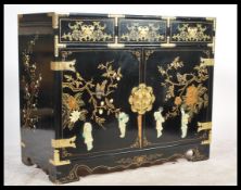 A 19th century style aesthetic movement black lacquered and chinoserie decorated sideboard having