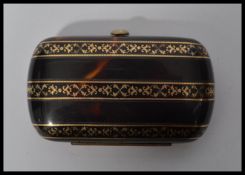 A nineteenth century French tortoiseshell purse with gold inlay and watered silk internal