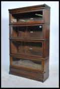 An Edwardian solid oak  4 section /  tier lawyers - barristers stacking bookcase cabinet by  Globe