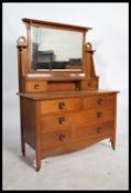 An early 20th Century  Art Nouveau oak dressing chest table, with rectangular mirror plate, two