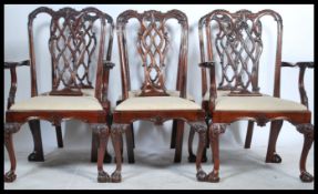 A set of six Chippendale-style mahogany dining chairs, 20th century, each with pierced and scroll