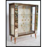 A 1930's display cabinet having a lined interior with fitted shelves, central astragal glazed door