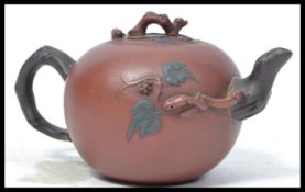 A 19th century Chinese terracotta tea pot having r