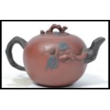 A 19th century Chinese terracotta tea pot having r