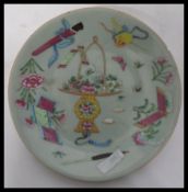 An early 19th Century Chinese Celadon plate decorated with various different scenes, character marks