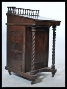 A 19th century country elm and oak Davenport, fitted with a fully appointed stationery compartment