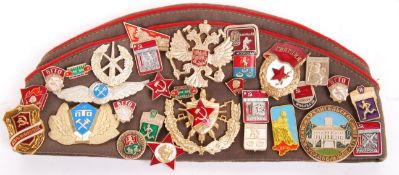 RUSSIAN UNIFORM FORAGE CAP WITH ASSORTED MEDALS / BADGES