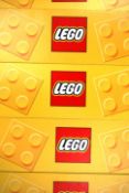 A collection of 6x Lego shop point of sale advertising card display banners having the yellow