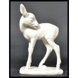 A Goebels ceramic figurine of a deer / faun raised