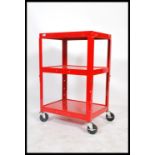 A vintage style industrial two tier trolley raised