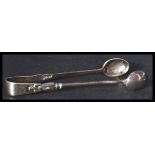 A pair of silver hallmarked Walker and Hall sugar