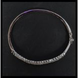 A sterling silver and CZ bangle bracelet having tw